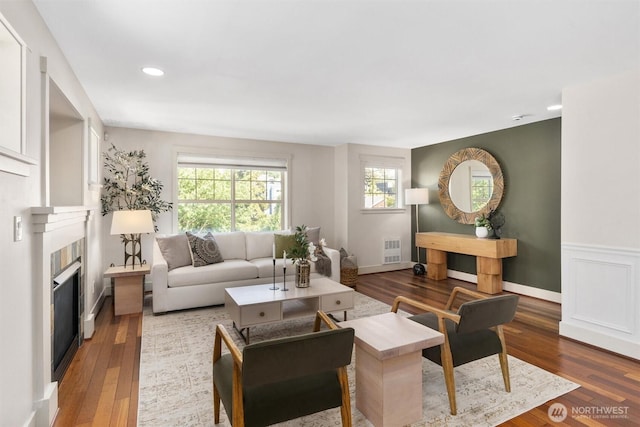 403 21st Ave, Seattle, WA 98122 - living room featuring wood finished floors, a fireplace, and recessed lighting