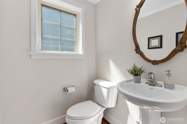 403 21st Ave, Seattle, WA 98122 - half bathroom featuring baseboards, toilet, and a sink