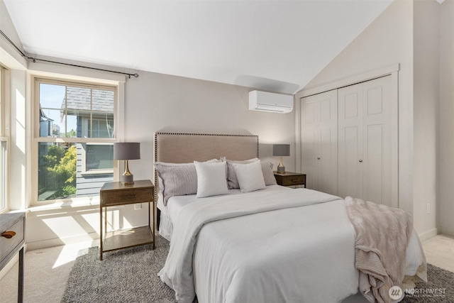 403 21st Ave, Seattle, WA 98122 - bedroom with a wall mounted AC, carpet floors, lofted ceiling, a closet, and baseboards