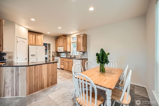 dining space with recessed lighting