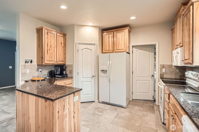 kitchen with white appliances, light brown cabinetry, a peninsula, decorative backsplash, and recessed lighting