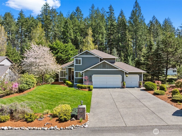 7811 Broadstone Pl SW, Port Orchard, WA 98367 - view of front of house featuring an attached garage, driveway, a front yard, board and batten siding, and a shingled roof