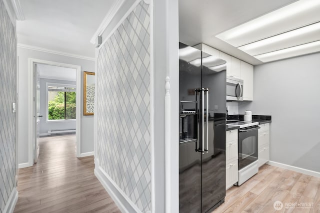 10004 NE 122nd St Unit T-D, Kirkland, WA 98034 - kitchen with range with electric cooktop, stainless steel microwave, high quality fridge, a baseboard heating unit, and white cabinetry