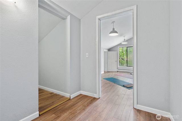 10004 NE 122nd St Unit T-D, Kirkland, WA 98034 - corridor with lofted ceiling, wood finished floors, and baseboards