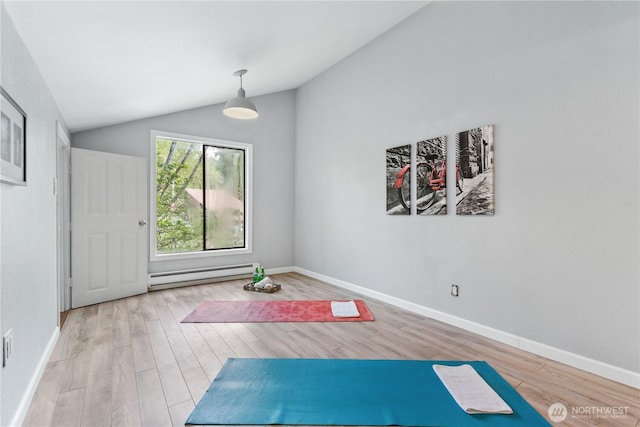 10004 NE 122nd St Unit T-D, Kirkland, WA 98034 - workout room with a baseboard heating unit, wood finished floors, vaulted ceiling, and baseboards