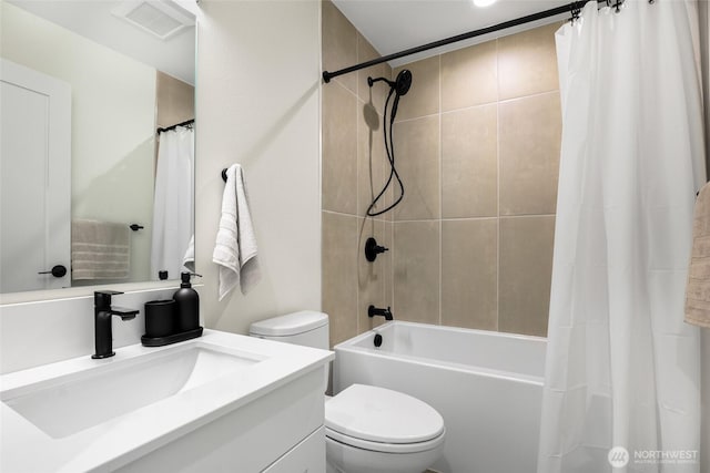 bathroom with toilet, vanity, and shower / tub combo