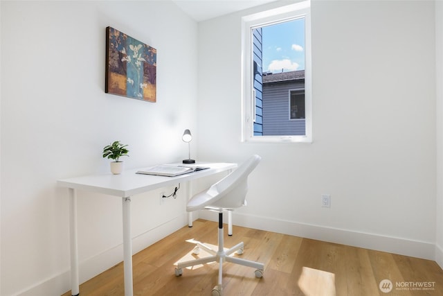 home office featuring light wood-style floors and baseboards