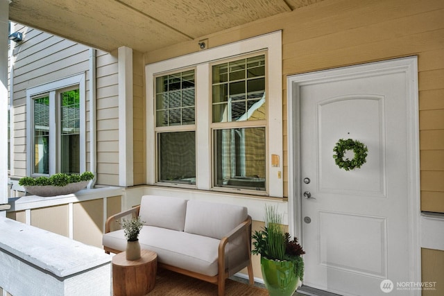 doorway to property featuring covered porch