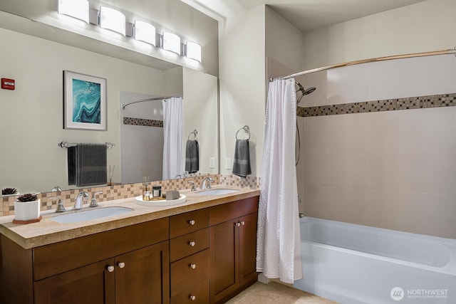 full bathroom featuring shower / tub combo, backsplash, double vanity, and tile patterned floors