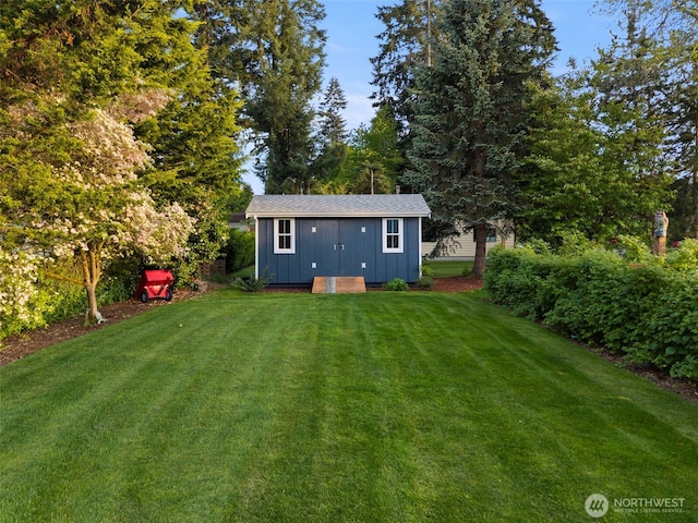 4354 Dyes Inlet Rd NW, Bremerton, WA 98312 - back of property featuring a lawn, board and batten siding, an outdoor structure, and a storage shed