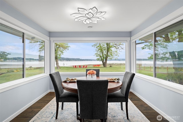4354 Dyes Inlet Rd NW, Bremerton, WA 98312 - sunroom featuring baseboards, a water view, and wood finished floors