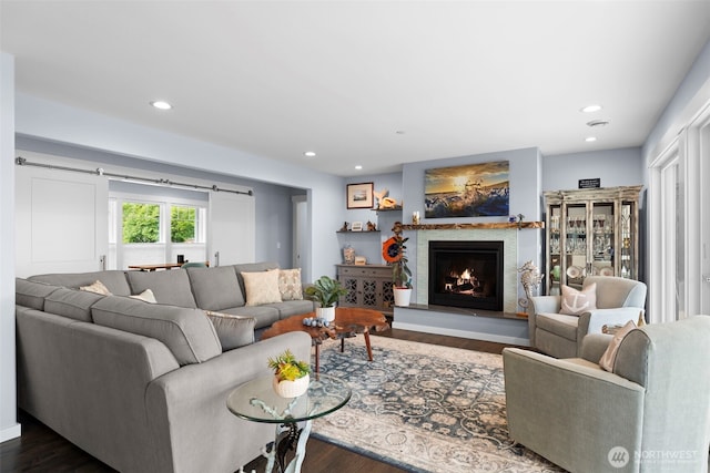 4354 Dyes Inlet Rd NW, Bremerton, WA 98312 - living area with dark wood-type flooring, a warm lit fireplace, and recessed lighting
