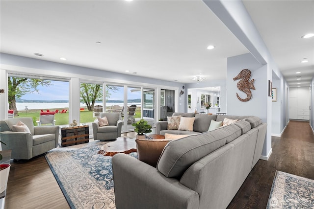 4354 Dyes Inlet Rd NW, Bremerton, WA 98312 - living room featuring healthy amount of natural light, dark wood finished floors, recessed lighting, baseboards, and a water view
