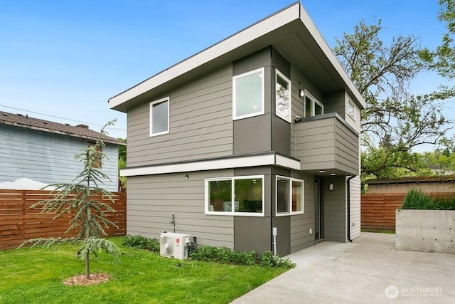 rear view of house featuring a patio and ac unit