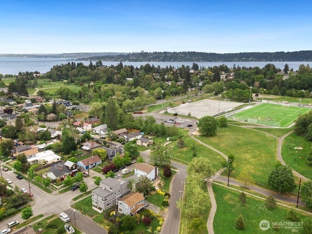 aerial view of residential area with a large body of water
