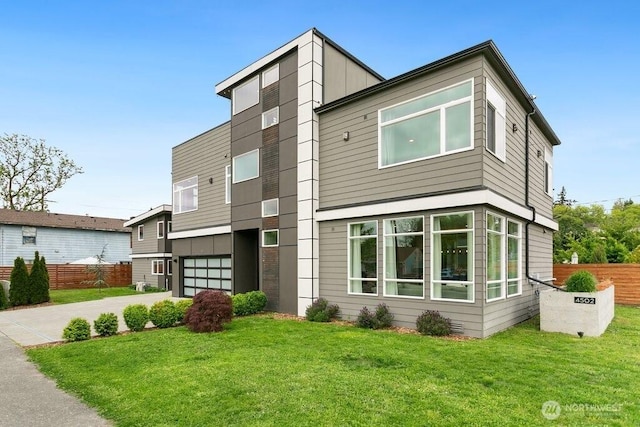 4502 41st Ave S, Seattle, WA 98118 - modern home featuring a garage and concrete driveway