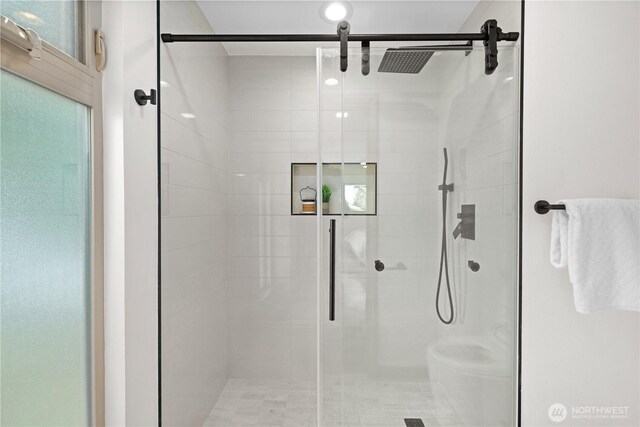 full bathroom with a shower stall