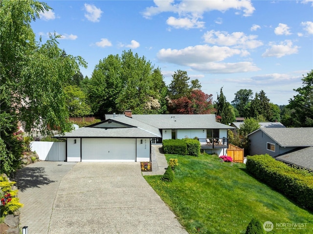 view of front of property featuring driveway and an attached garage