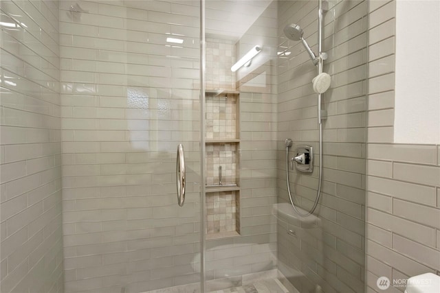 bathroom featuring a shower stall