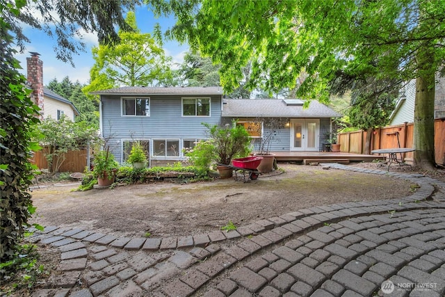 back of house with a wooden deck