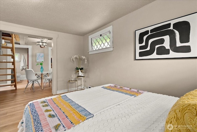 508 N 95th St, Seattle, WA 98103 - bedroom featuring wood finished floors and a textured ceiling