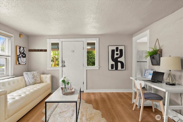 508 N 95th St, Seattle, WA 98103 - living room with wood finished floors, a textured ceiling, and baseboards