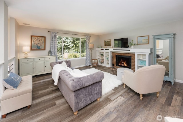 24222 92nd Ave W, Edmonds, WA 98020 - living room with dark wood finished floors, a brick fireplace, and baseboards