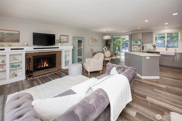 24222 92nd Ave W, Edmonds, WA 98020 - living area with dark wood-type flooring, recessed lighting, and a fireplace