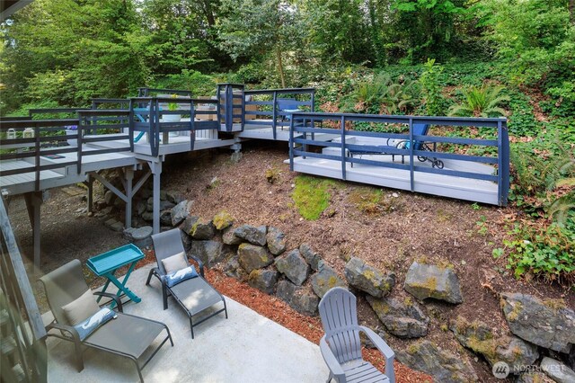 24222 92nd Ave W, Edmonds, WA 98020 - view of yard featuring a wooden deck and a view of trees
