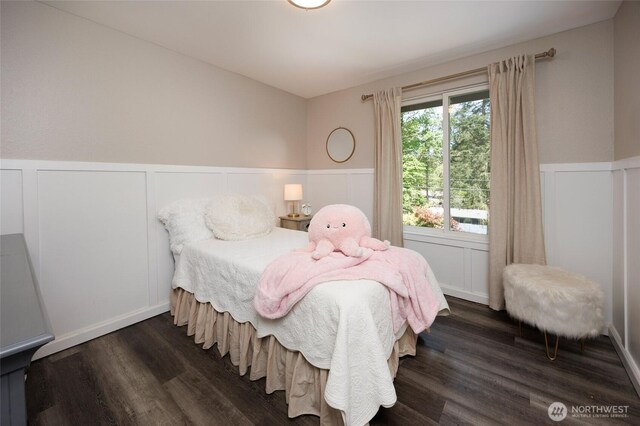 24222 92nd Ave W, Edmonds, WA 98020 - bedroom with a wainscoted wall, dark wood-style flooring, and a decorative wall