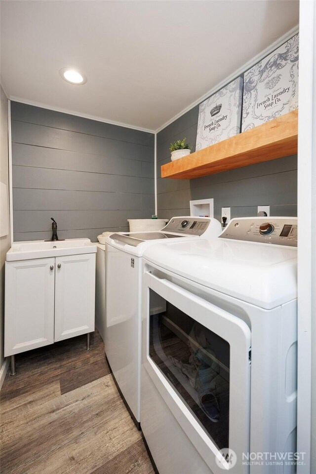 24222 92nd Ave W, Edmonds, WA 98020 - laundry area featuring washer and dryer, wood finished floors, cabinet space, and recessed lighting