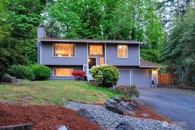 24222 92nd Ave W, Edmonds, WA 98020 - raised ranch featuring a chimney, driveway, and an attached garage