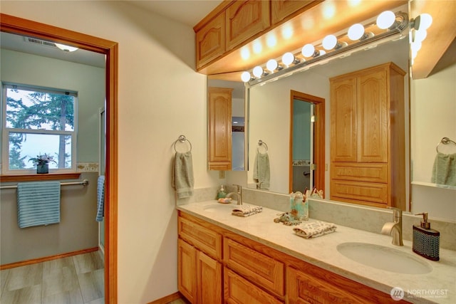 362 N Sunrise Blvd, Camano Island, WA 98282 - bathroom featuring double vanity and baseboards