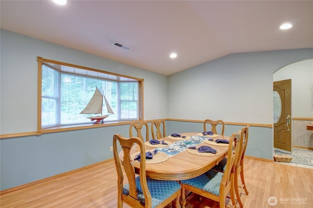 362 N Sunrise Blvd, Camano Island, WA 98282 - dining area with light wood finished floors, arched walkways, recessed lighting, vaulted ceiling, and baseboards