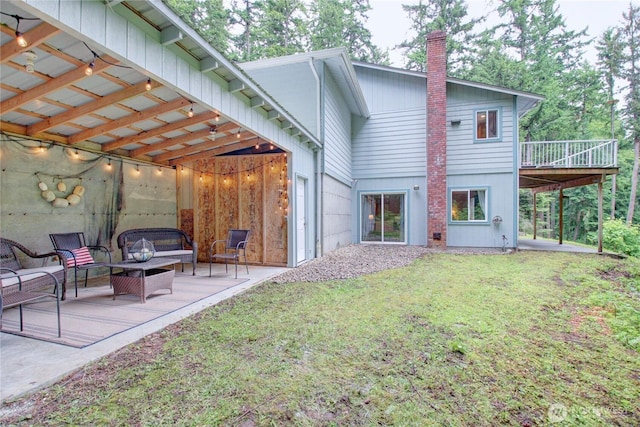 362 N Sunrise Blvd, Camano Island, WA 98282 - back of house featuring a patio area, a chimney, a yard, a deck, and outdoor lounge area