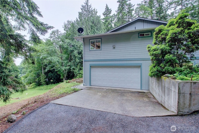 362 N Sunrise Blvd, Camano Island, WA 98282 - view of home's exterior featuring an attached garage and concrete driveway