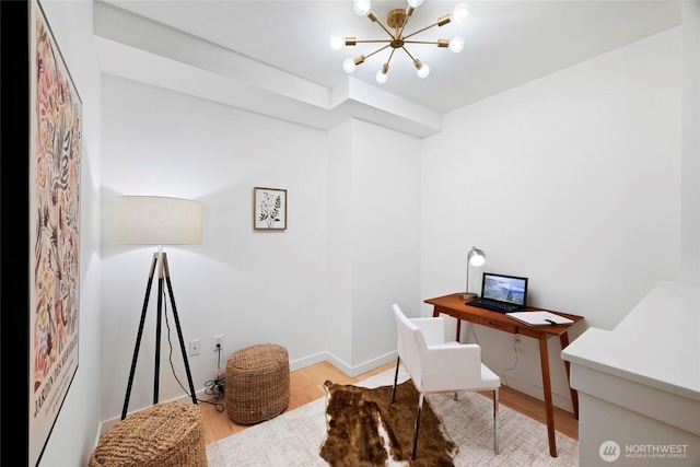 2607 Western Ave Unit 202, Seattle, WA 98121 - office featuring a chandelier, wood finished floors, and baseboards