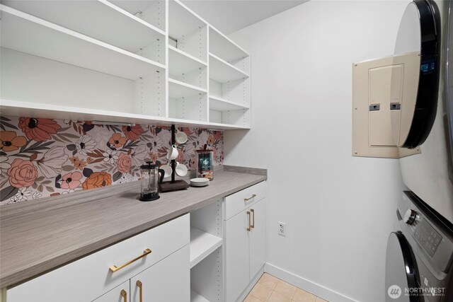 2607 Western Ave Unit 202, Seattle, WA 98121 - pantry featuring stacked washing machine and dryer