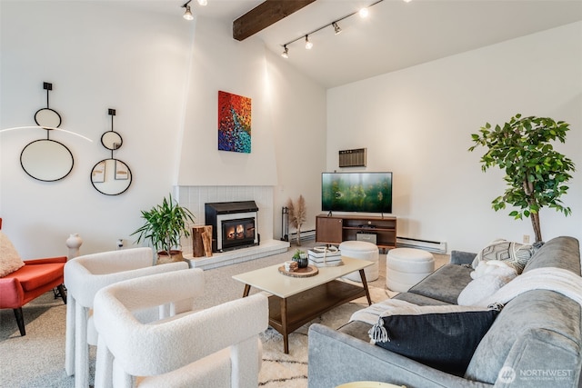 135 N 46th St Unit 402, Seattle, WA 98103 - carpeted living area featuring baseboard heating, track lighting, a tile fireplace, beam ceiling, and high vaulted ceiling