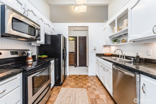 135 N 46th St Unit 402, Seattle, WA 98103 - kitchen featuring stainless steel appliances, a sink, white cabinetry, and open shelves