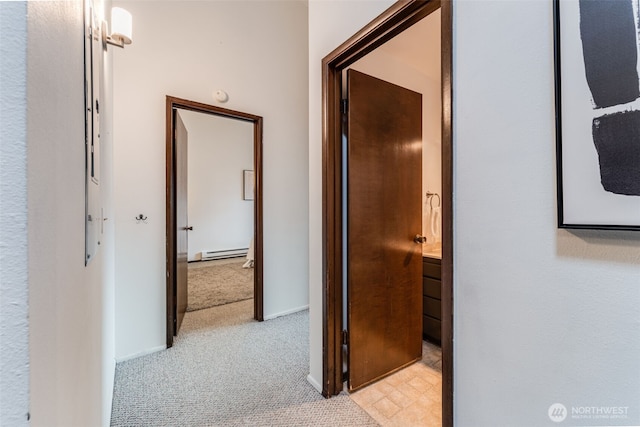 135 N 46th St Unit 402, Seattle, WA 98103 - corridor with a baseboard heating unit, light colored carpet, and baseboards