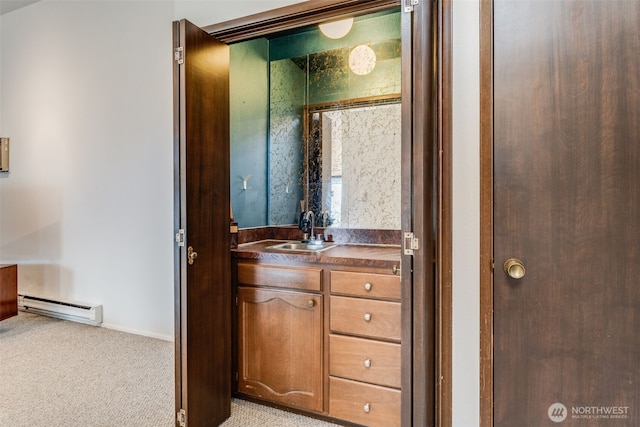 135 N 46th St Unit 402, Seattle, WA 98103 - bathroom featuring a baseboard heating unit, vanity, and baseboards