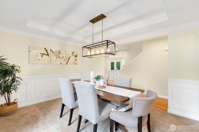 23322 SE 26th Pl, Sammamish, WA 98075 - dining room with a tray ceiling, ornamental molding, light colored carpet, a decorative wall, and a wainscoted wall