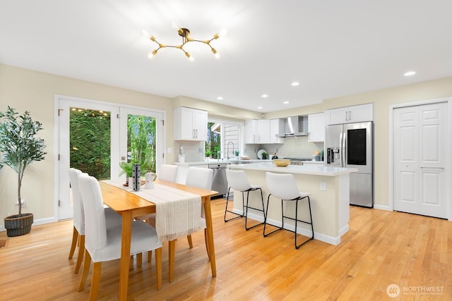 23322 SE 26th Pl, Sammamish, WA 98075 - dining space with light wood finished floors, recessed lighting, and baseboards