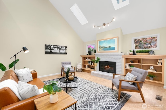 23322 SE 26th Pl, Sammamish, WA 98075 - living area featuring a skylight, light colored carpet, a brick fireplace, high vaulted ceiling, and baseboards