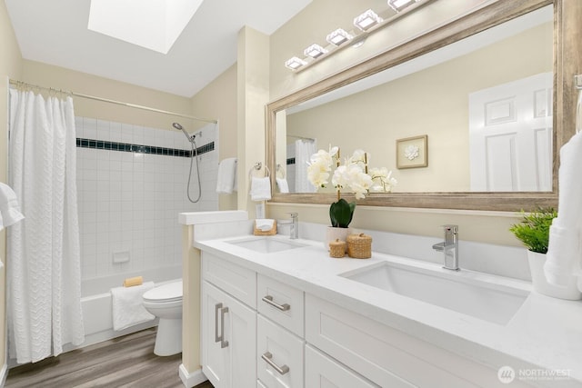 23322 SE 26th Pl, Sammamish, WA 98075 - full bathroom with a skylight, toilet, wood finished floors, shower / tub combo with curtain, and double vanity