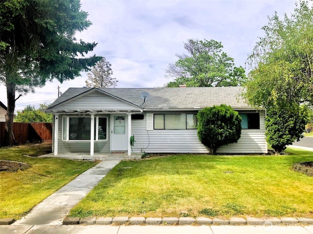 953 E Ash St, Othello, WA 99344 - view of front of property featuring a shingled roof and a porch