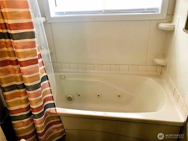 953 E Ash St, Othello, WA 99344 - bathroom with a tub with jets and a shower with shower curtain
