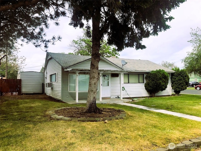 953 E Ash St, Othello, WA 99344 - view of front of property featuring cooling unit and roof with shingles
