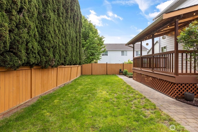 view of yard with a wooden deck